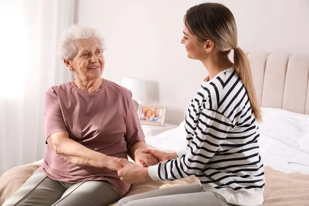 Caregiver helping a Bay Area senior with personal care at home