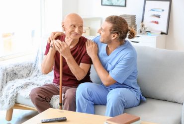 Elderly,Man,With,Caregiver,In,Nursing,Home