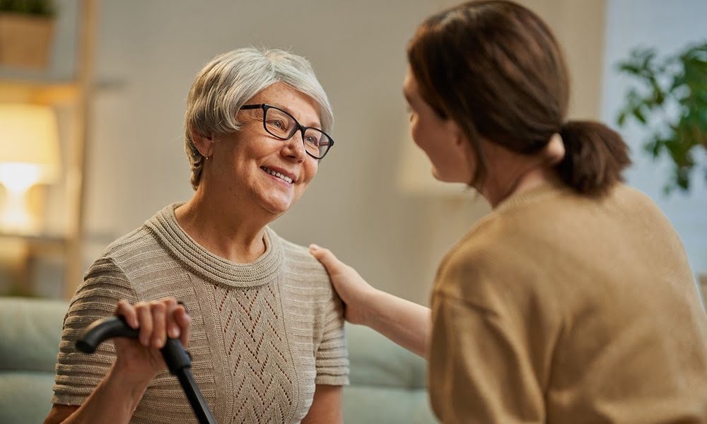 Caregiver supporting a senior with dementia at home